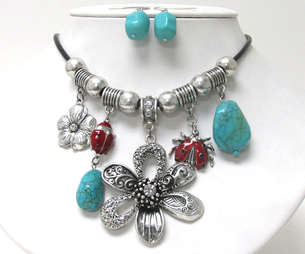 Turquoise stone and bug and flower dangle necklace earring set