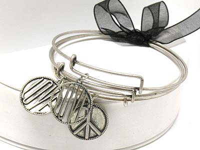 Cut out metal disk charms triple bangle liked by ribbon