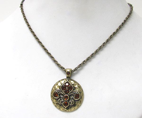 Crystal fluer de lis on hammered disk pendant necklace