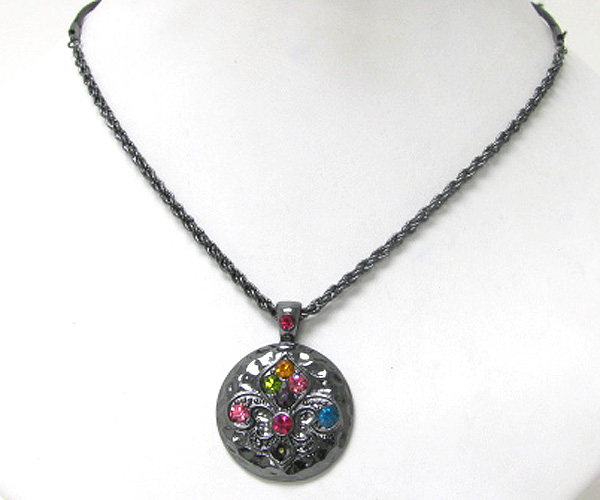 Crystal fluer de lis on hammered disk pendant necklace