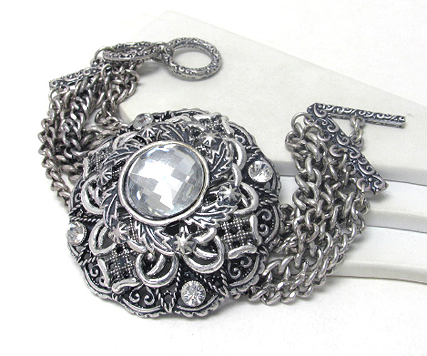 Facet glass and crystal deco on metal filigree and multi chain toggle bracelet