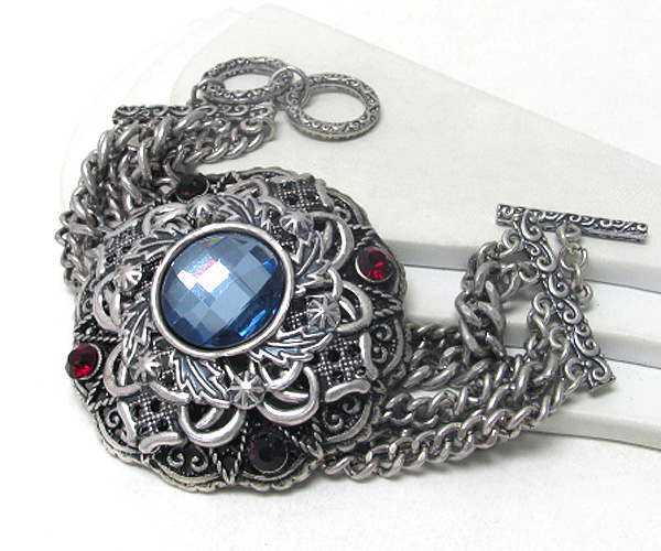 Facet glass and crystal deco on metal filigree and multi chain toggle bracelet