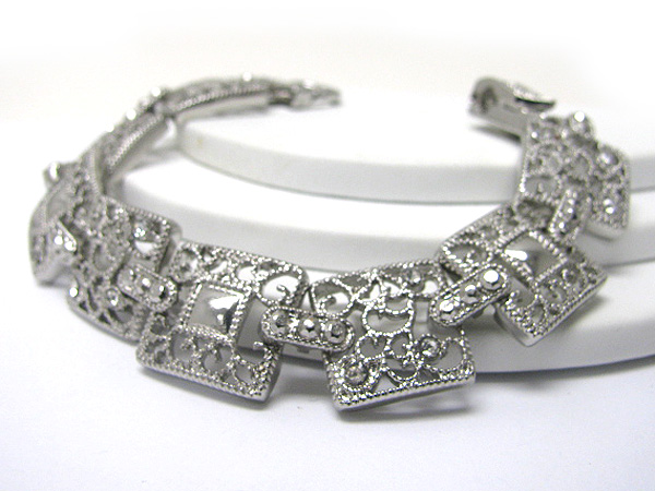 Crystal and filigree metal disk link bracelet