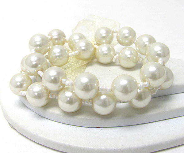 Ribbon tie multi pearl link double stretch bracelet