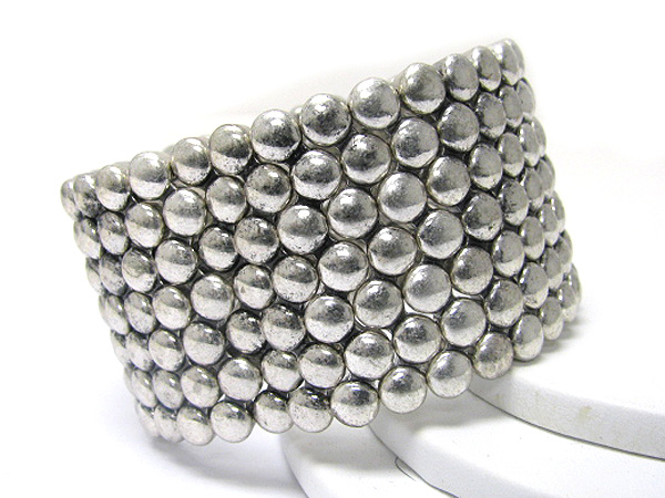 Small metal disk woven stretch bracelet