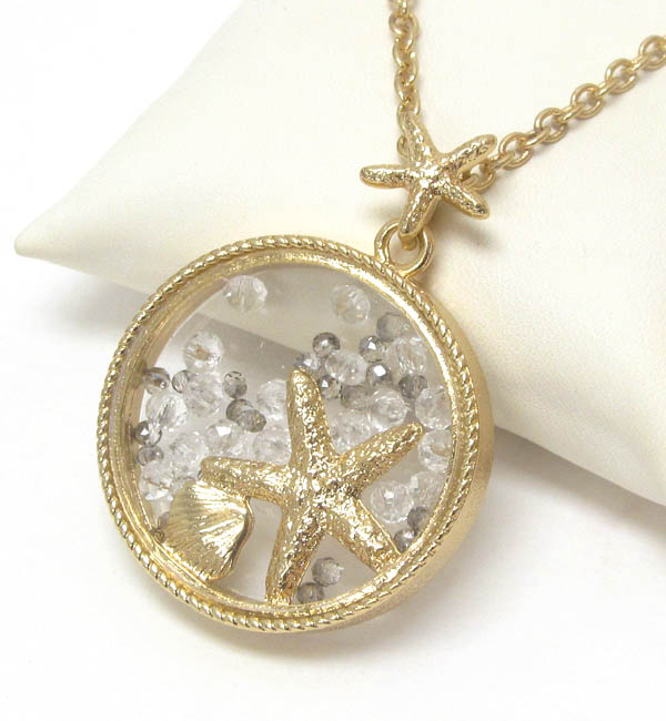 Starfish and floating bead in glass disk pendant necklace