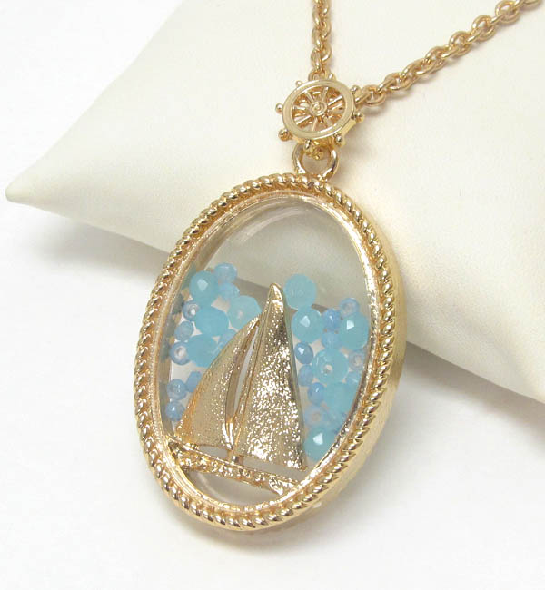 Sail boat and floating bead in glass oval pendant necklace