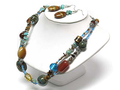 Turquoise and figurine stone double strand necklace and earring set