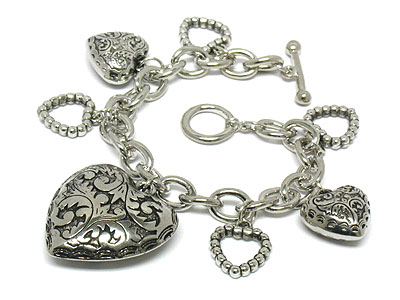 Antique style multi metal heart charm toggle bracelet