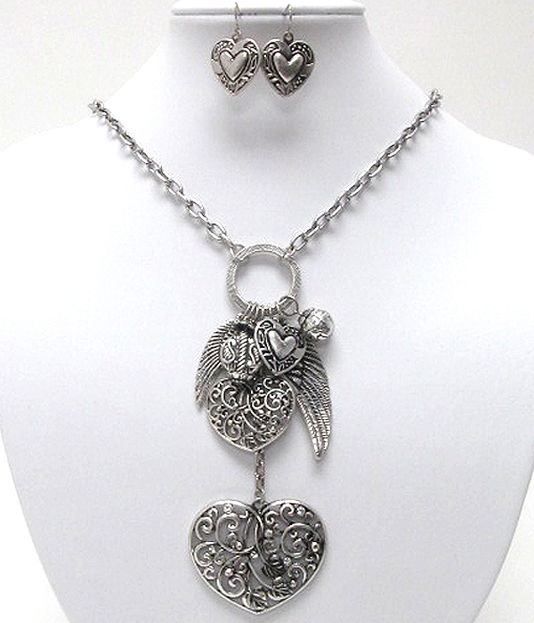 Multi textured metal heart and wings dangle necklace earring set