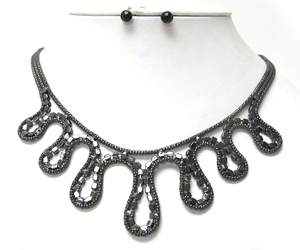 Crystal and metal wave line necklace earring set