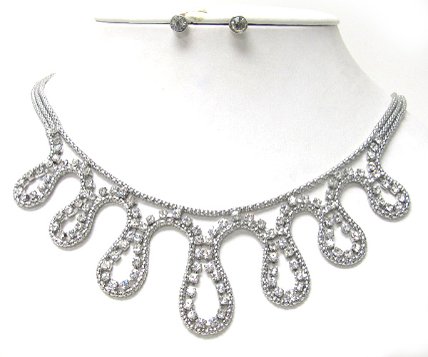 Crystal and metal wave line necklace earring set