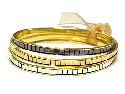 Ribbon tied tri tone metal bangle