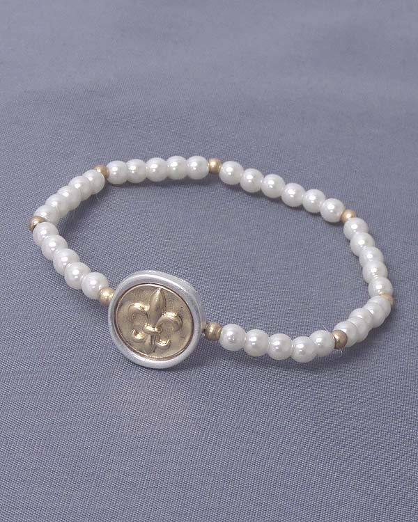 Fleur de lis stamp disk and stretch pearl bracelet