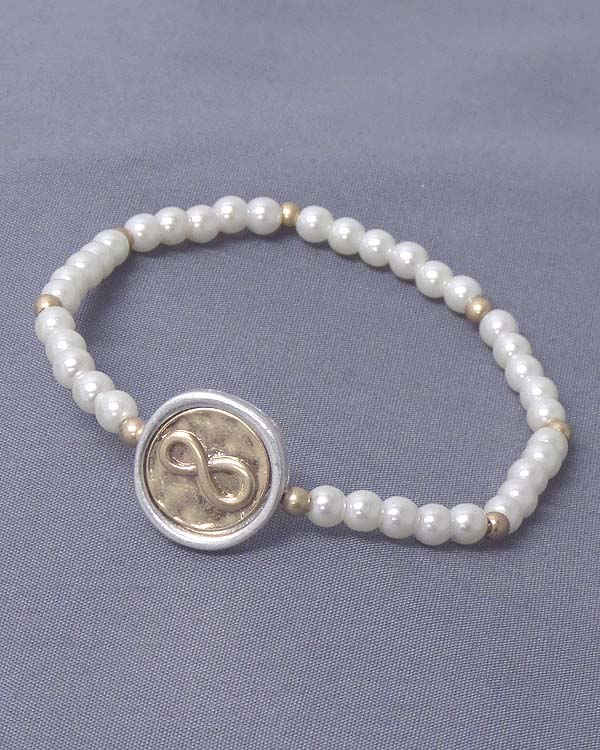 Infinity stamp disk and stretch pearl bracelet