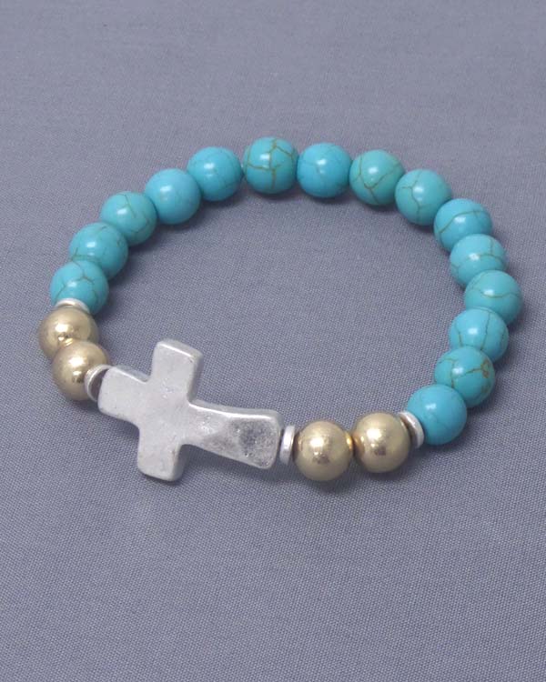 Hammered cross and metal ball and turquoise bead stretch bracelet