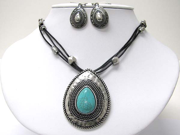 Turquoise center on textured tear drop metal cord necklace earring set