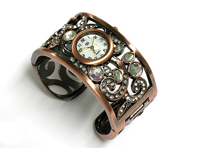 Crystal deco and cut out metal casting wide bangle watch