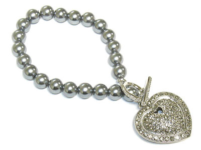 Paved crystal heart charm and glass pearl bracelet