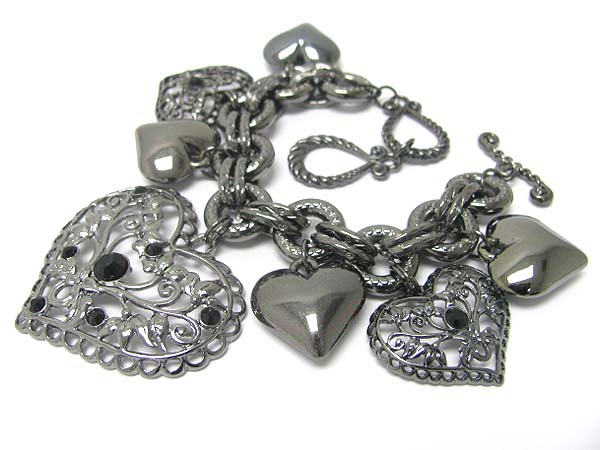 Crystal and metal filigree heart cahrm dangle toggle bracelet 