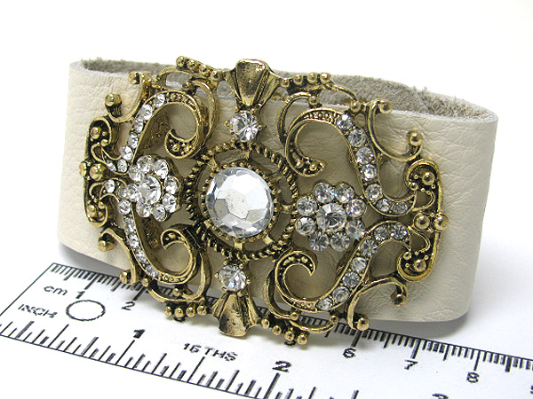 Multi crystal metal filigree on leather button bracelet