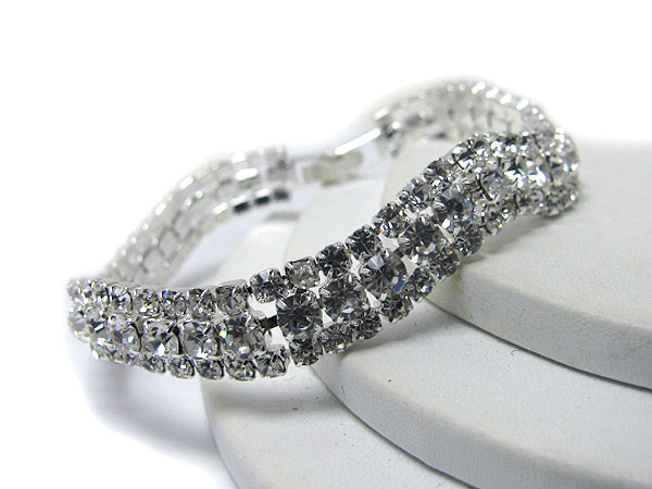 Center crystal and rhinestone edge covered wave bracelet