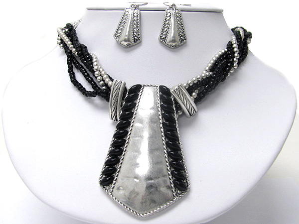 Ethnic style metal art medallion and multi bradied necklace earring set