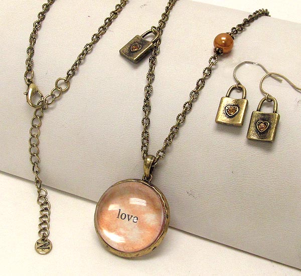 Metal textured lock and pearl drop round  clear acryl love theme necklace earring set