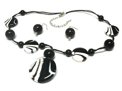 Marble and solid bead cord necklace and earring set 