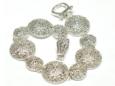 Metal filigree round disk link bracelet