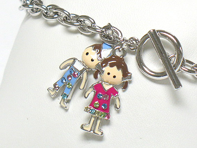 Whitegold palting crystal and enamel boy and girl charm toggle bracelet