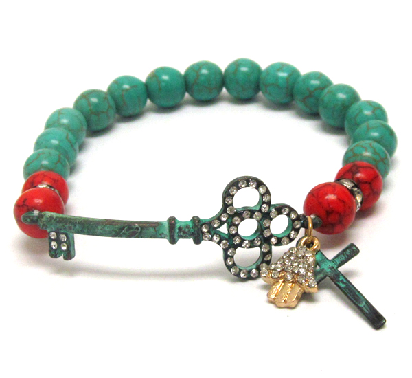 Crystal deco key and cross deoc and turquoise ball stretch bracelet