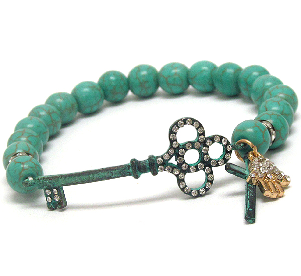 Crystal deco antique key and turquoise ball stretch bracelet