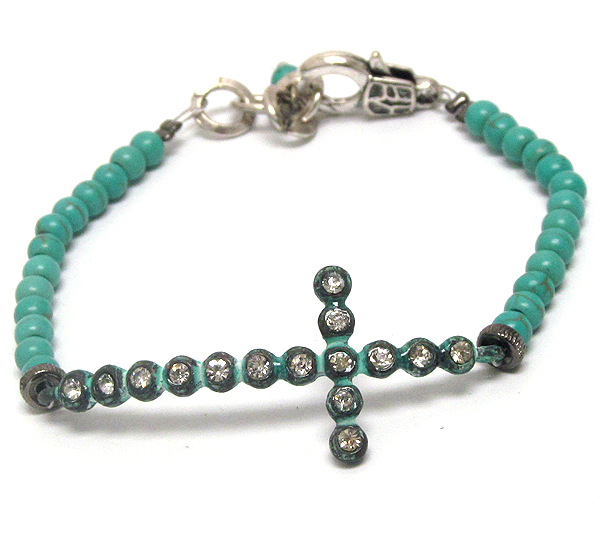 Crystal cross and turquoise ball stretch bracelet