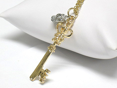 Two tone metal key and crown pendant necklace