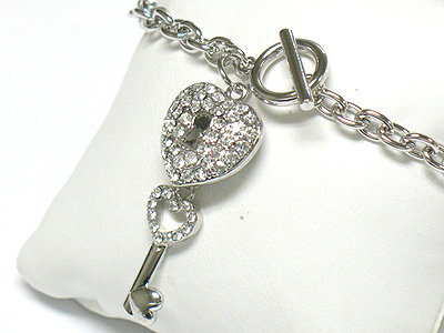 Whitegold palting crystal crown and key charm toggle bracelet