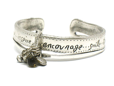 Metal center bunch of charms bangle with phrase