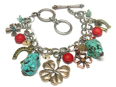 Turquoise stone and metal clover and horse toe  charms toggle bracelet