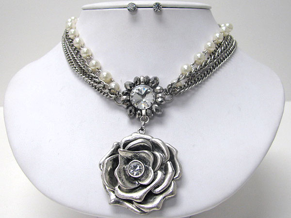 Crystal center metal rose and multi chain necklace earring set