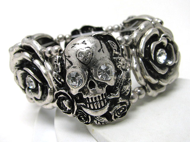 Crystal stud scultured metal skull and flower stretch bracelet