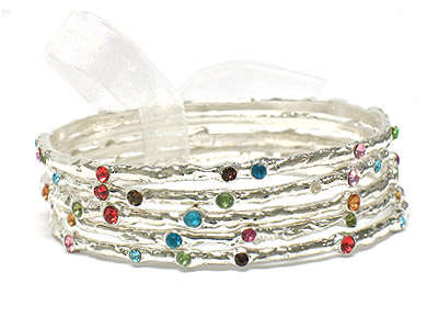 Five hammered metal bangle and crystal bracelet