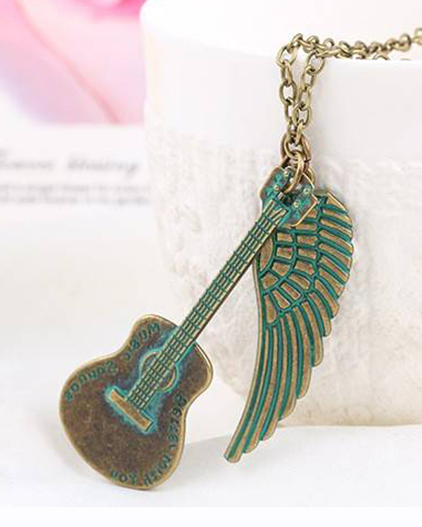 Vintage bohemian patina guitar and wing pendant necklace