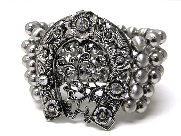 Crystal large filigree horse shoe and multi metal balls stretch bracelet