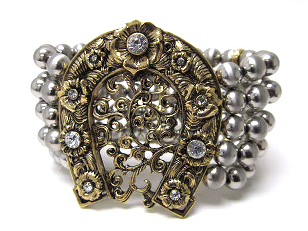 Crystal large filigree horse shoe and multi metal balls stretch bracelet