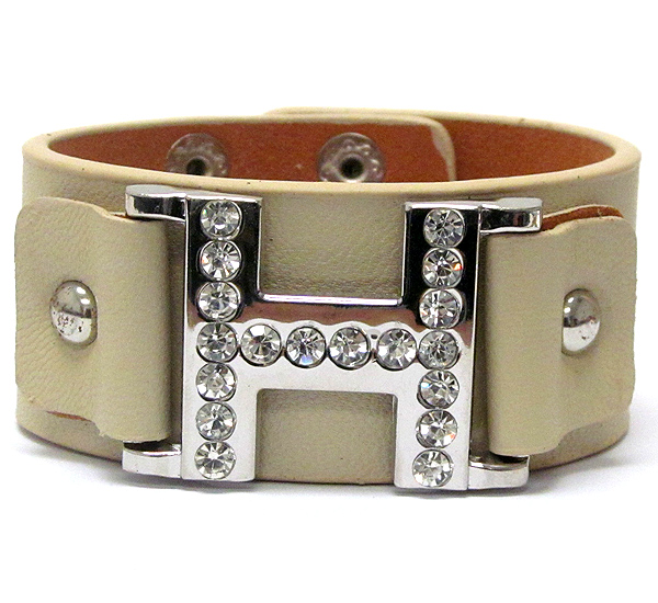 Crystal stud metal h symbol leatherette bracelet