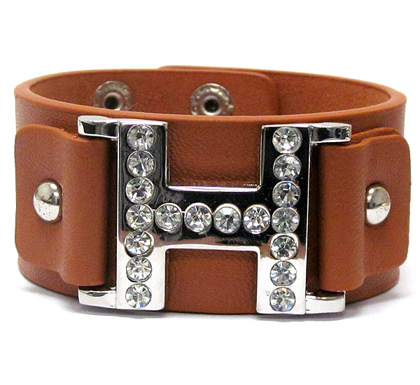 Crystal stud metal h symbol leatherette bracelet