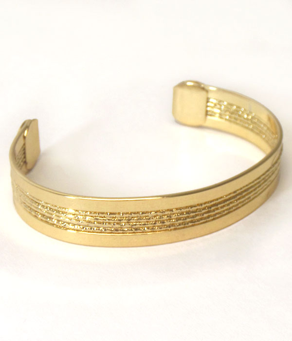 Textured center line metal bangle bracelet