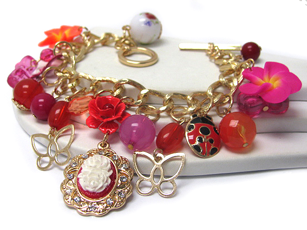 Multi flower and stone charm toggle bracelet