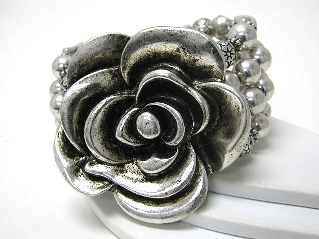 Metal flower and multi row metal ball stretch bracelet