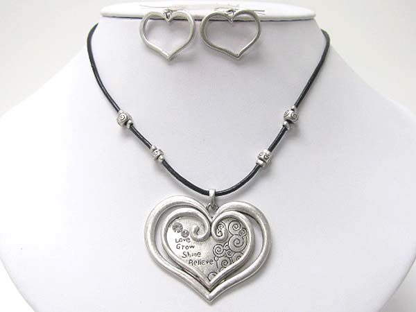 Textured metal double heart and cord necklace earring set